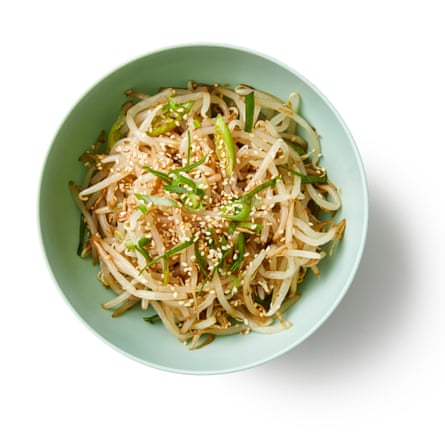 A bowl of beansprouts. In the same water as the spinach, boil the beansprouts for four or five minutes, until tender, then drain and refresh under cold water. Mix with the garlic, spring onions, sesame oil and seeds, and a good pinch of salt, then set aside with the spinach.