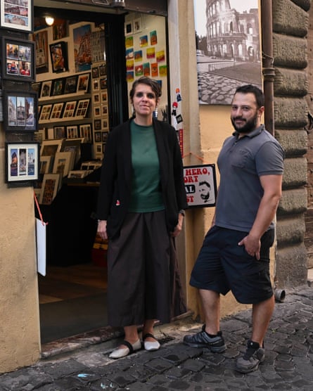Nora and Carlo at the door of their shop