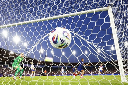 Marie-Antoinette Katoto watches the ball bulge the net as she puts France 1-0 up, as England’s goalkeeper, Hannah Hampton, looks on