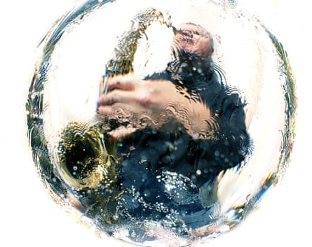 A saxophonist with the image distorted by water.