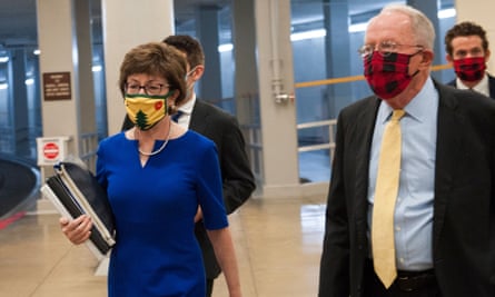 Susan Collins and Lamar Alexander make their way to the Senate chamber for a vote.