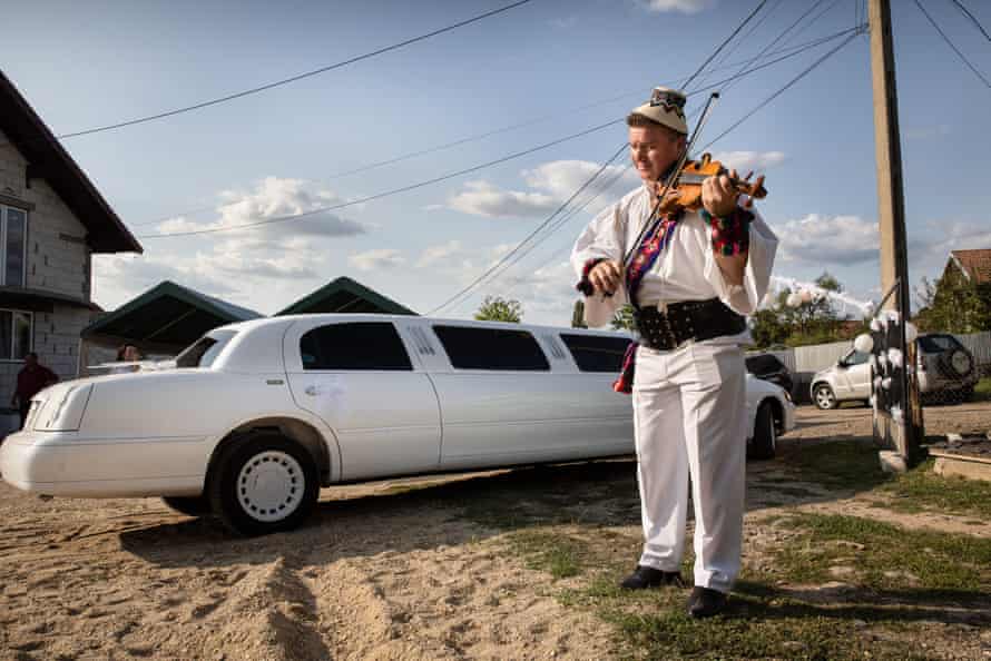 A violinist plays a traditional song during Marian and Madalina Bosinceanu's wedding in the village of Vama.