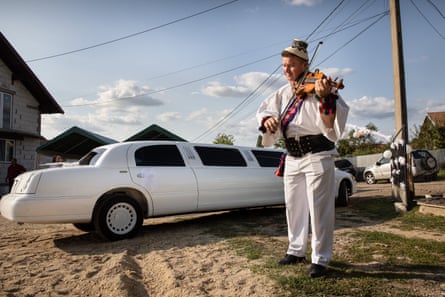 A fiddler plays a traditional song during the wedding of Marian and Madalina Bosinceanu in the village of Vama.