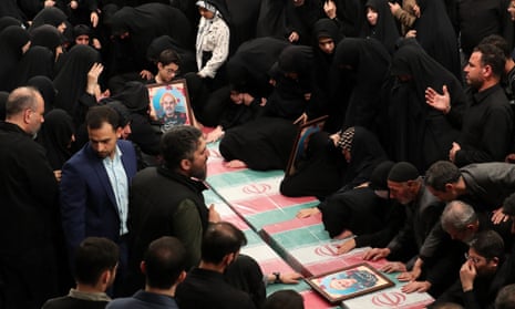A handout picture provided by the office of Iran’s Supreme Leader Ayatollah Ali Khamenei shows relatives mourning over the coffins of seven Revolutionary Guard Corps members killed in a strike on the country’s consular annex in Damascus, which Tehran blamed on Israel.