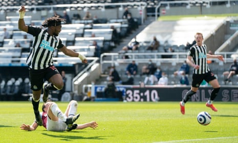 Newcastle’s Allan Saint-Maximin, left, forces the games first goal as he shoots past West Ham’s Mark Noble.