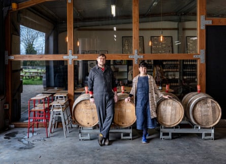 Adrian Pike, winemaker and managing director with his wife Galia next to barrels