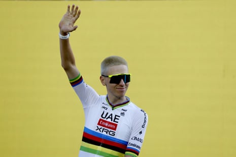 Tadej Pogacar waving to crowds