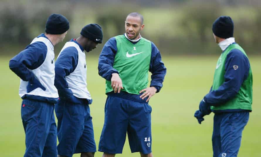 Thierry Henry (centre) talks to his Arsenal team-mates in training in April 2004.