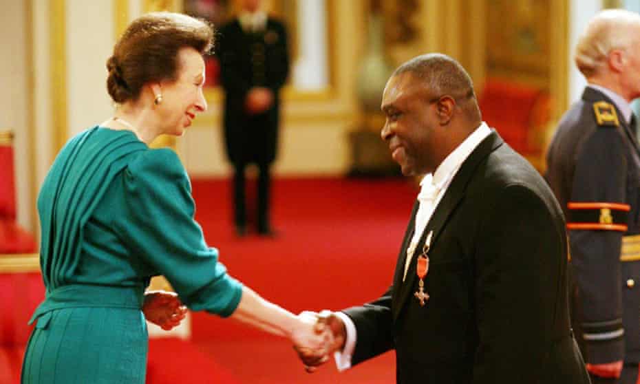 Adebayo receives an MBE from the Princess Royal in 2009.