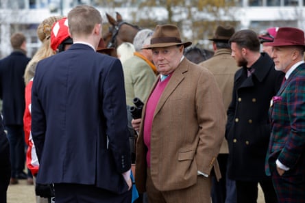 Nicky Henderson in the unsaddling enclosure after his horse Jingko Blue pulled up in the opening race