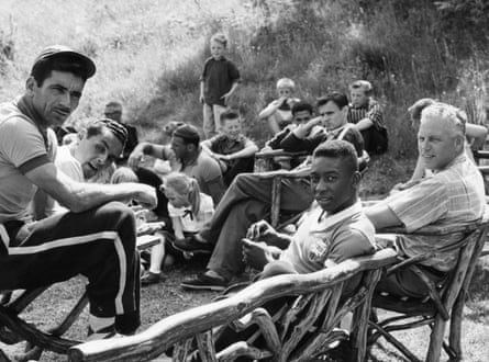 Pelé and the Brazil team and staff relax at their base outside Gothenburg during the 1958 World Cup.