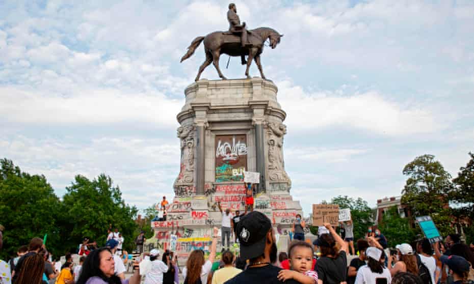 Protesters around the Robert E Lee statue on Monument Avenue in Richmond, Virginia. Richmond’s mayor has said the statue will be removed this month.