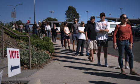 People wait in line to cast their ballots in Huntington Beach
