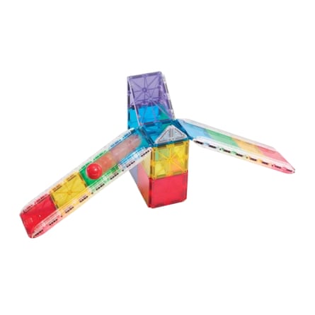 Translucent magnetic building tiles form a tower with three tracks, holding a red ball