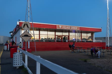 An old-fashioned diner in a paved car park