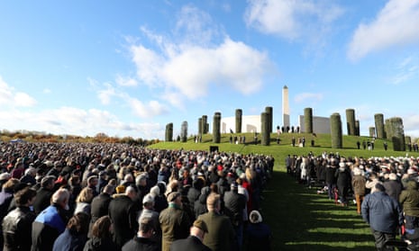 People attend a ceremony at the National Memorial Arboretum, Alrewas, Staffordshire.