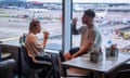 Manchester Airport travel drinking<br>© Joel Goodman for the Guardian - 07973 332324 - all rights reserved . 08/08/2024 . Manchester , UK . Couple EVIE CALCUTT (21) and HARVEY BALL (23) (from Nottingham), in a bar at the T2 West Departure lounge, on their way to New York. Exploring whether the eating and drinking habits of travellers at Manchester Airport have changed. Photo credit : Joel Goodman