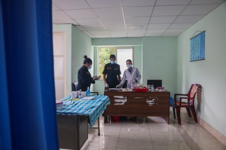 Hospital workers prepare to take blood samples