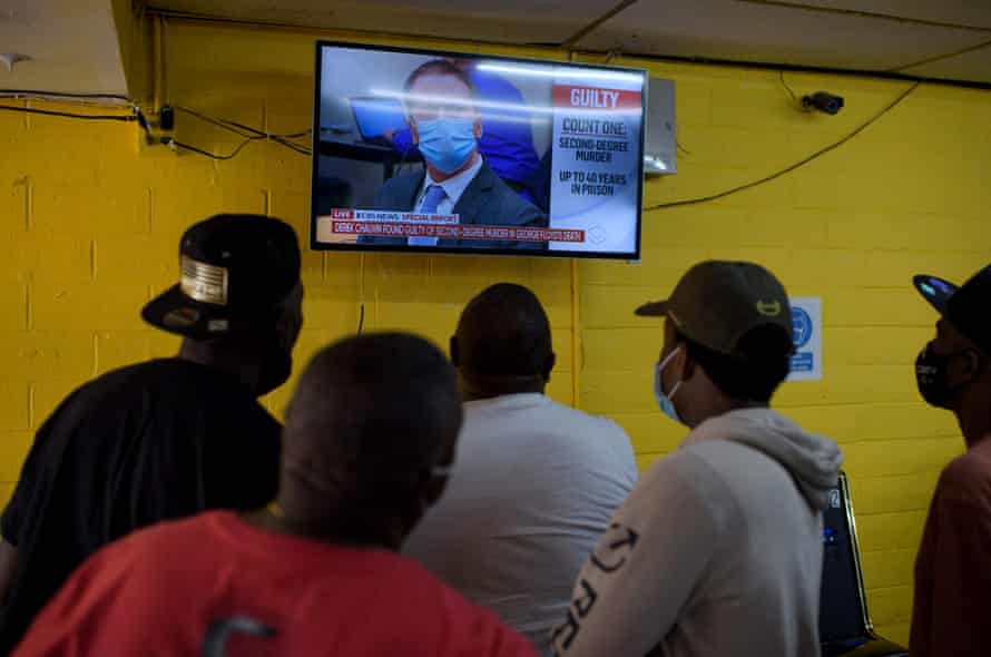 People inside the Twees Foods Store in the Third Ward where George Floyd grew up watch the verdict in Derek Chauvin’s trial in Houston, Texas.