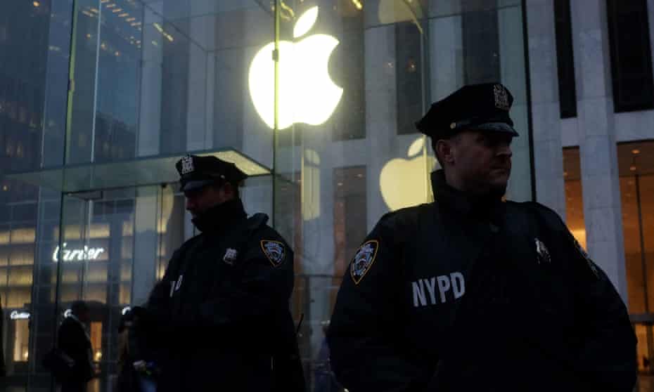 New York police officers on guard outside the New York Apple Store