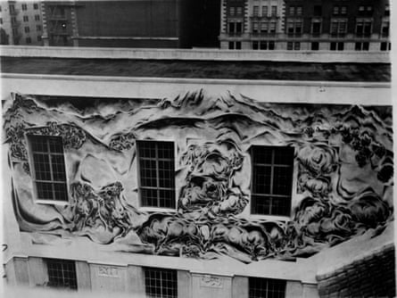A frieze depicting frieze a bison hunt on the exterior of a building.