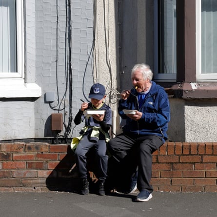 Generations eating chips on Gwladys Street.
