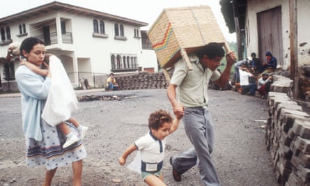 Refugees walk past barricades on 1 July 1979 in Nicaragua.
