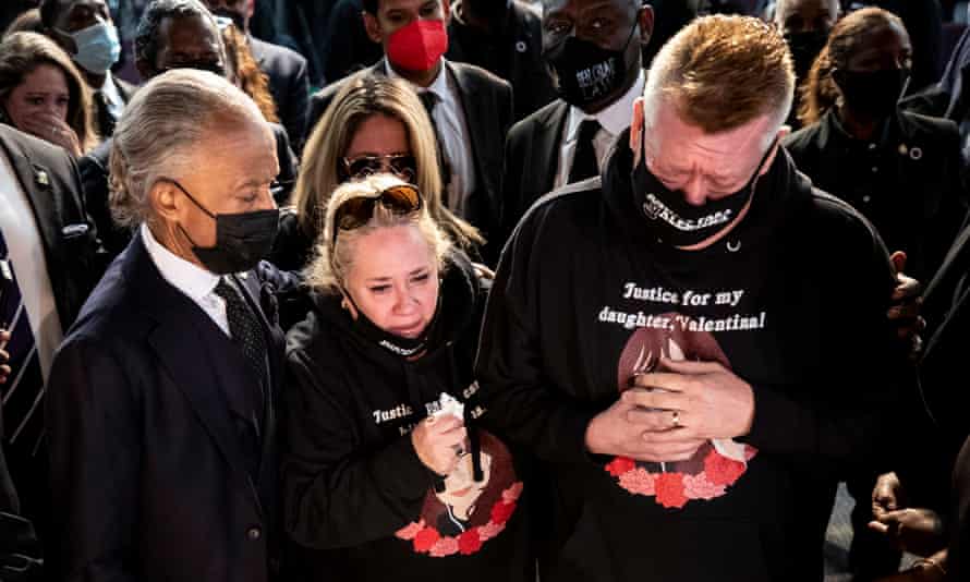 Orellana-Peralta’s parents mourn over the casket of their daughter in Gardena, California.