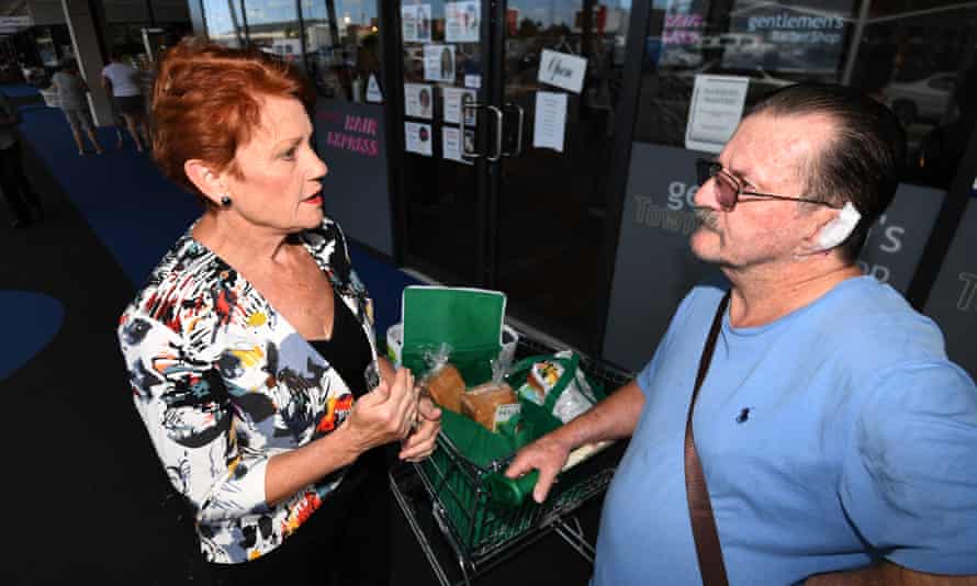One Nation leader Senator Pauline Hanson talks to a Queenslander last March, six months before One Nation saw its vote collapse in the state election.