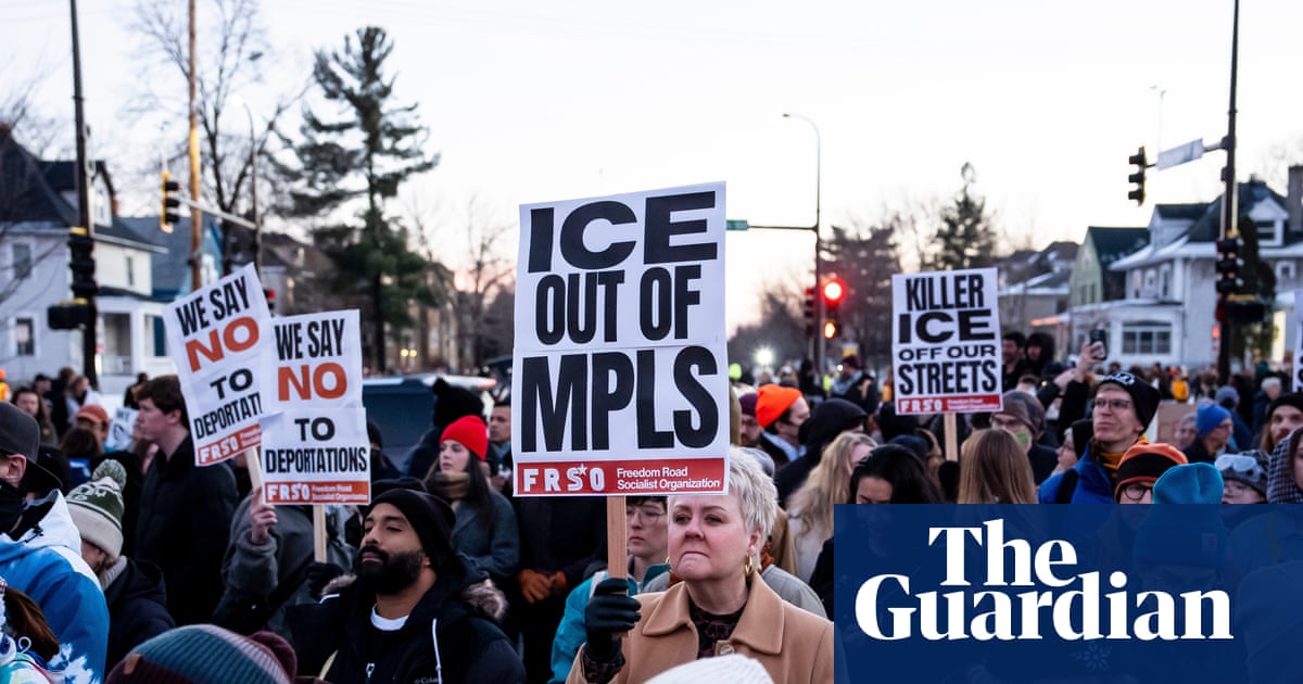 Minneapolis residents hold vigil for woman fatally shot by ICE agent – video