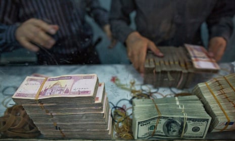 Workers count banknotes of various currencies at the headquarters of the Da Afghanistan Bank in Kabul, Afghanistan. 