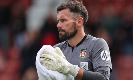 Ben Foster looks despondent after Wrexham’s 5-3 defeat by Milton Keynes Dons on the opening day of this season.