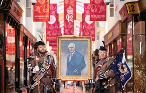 portrait with people in uniform next to it