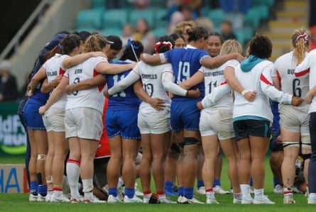 Players from both sides gather together after the final whistle.