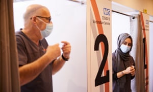 Pharmacists Peter Marks and Rohina Arshad at work at the vaccination centre