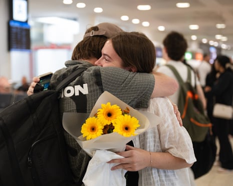 Passengers on a flight from Abu Dhabi arriving at Sydney international airport on Friday