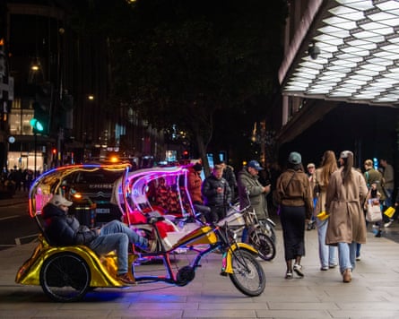 Pedicabs parked on pavement