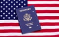 A canceled US Passport book lying on the US flag.