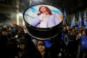 A supporter in Buenos Aires holds up a drum with an image of the former Argentine president Cristina Fernández de Kirchner