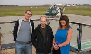 Some of the first passengers prepare to board the helicopter before the 15-minute flight to St Mary’s.