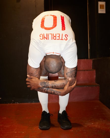 Matsena does stretches while wearing a Sterling shirt