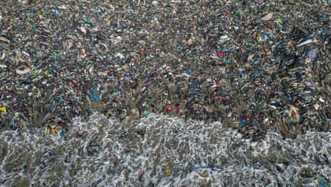 Seen from the air, textile waste pollutes the beach shore at Jamestown in Accra, Ghana.