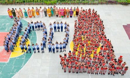 Indian school students and teachers pay tribute a day before the 100th anniversary of the Jallianwala Bagh massacre.