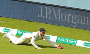 Jos Buttler stops the ball from going to the boundary.
