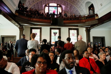 Attendees stand and turn their backs on Mike Bloomberg during a commemoration ceremony for the Bloody Sunday march in the Brown Chapel AME Church in Selma, Alabama, Sunday.