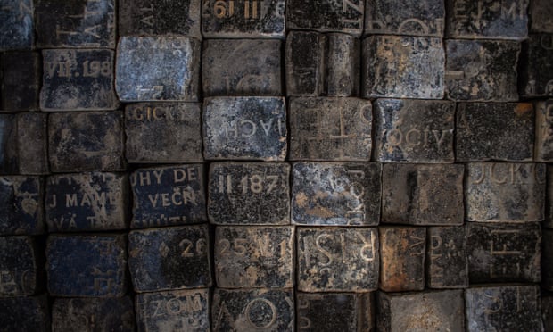 Damaged Jewish tombstones used to pave Czech sq. made into memorial | Czech Republic 1 Cobblestones made from Jewish tombstones on display at a construction site at Wenceslas Square in Prague in May 2020