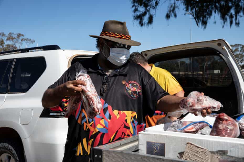 Leroy Johnson, the ranger from Mutawintji national park, comes to the outskirts of Wilcannia with Derek Harman to deliver fresh kangaroo meat to the community