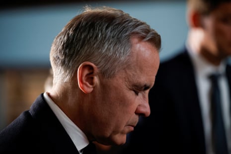 Canada's Prime Minister Mark Carney closes his eyes and bows his head as he mourns with members of the Filipino community at St. Mary the Virgin South Hill Church, after a vehicle was driven into a crowd at a Filipino community Lapu Lapu day block party, in Vancouver, British Columbia, Canada April 27, 2025.