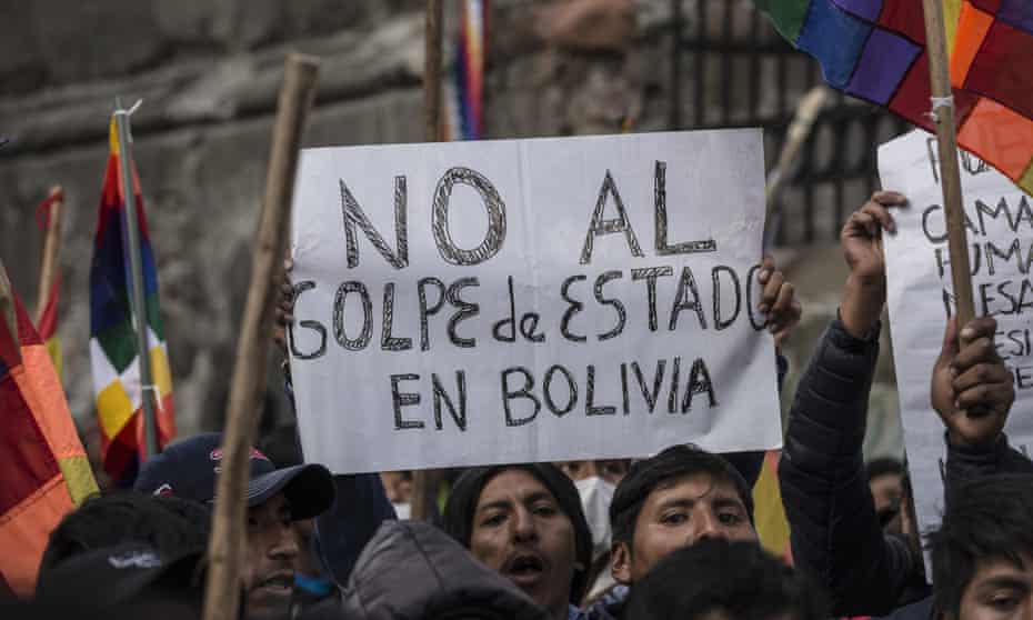 Evo Morales supporters protest in La Paz<br>LA PAZ, BOLIVIA - NOVEMBER 12 : A supporter of former President Evo Morales holds a banner during a protest in La Paz, Bolivia, on November 12, 2019. Protesters have been in the streets calling for Morales’ resignation. He stepped down after the army requested he leave his post and requested political asylum from Mexico. (Photo by Marcelo Perez Del Carpio/Anadolu Agency via Getty Images)