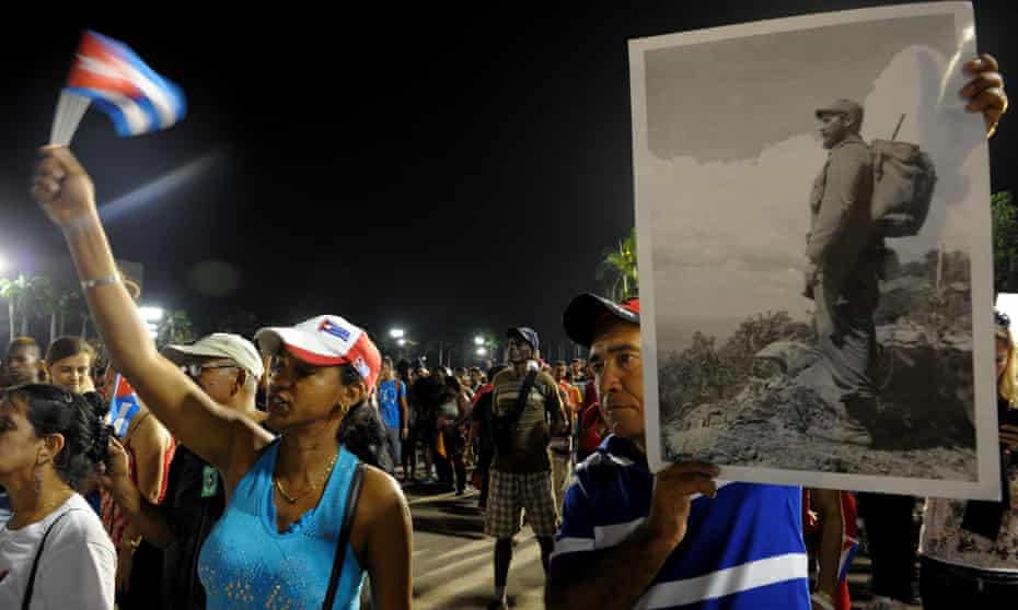 People pay homage to the late Cuban leader Fidel Castro on Saturday night during the last ceremony before his burial in Santiago.